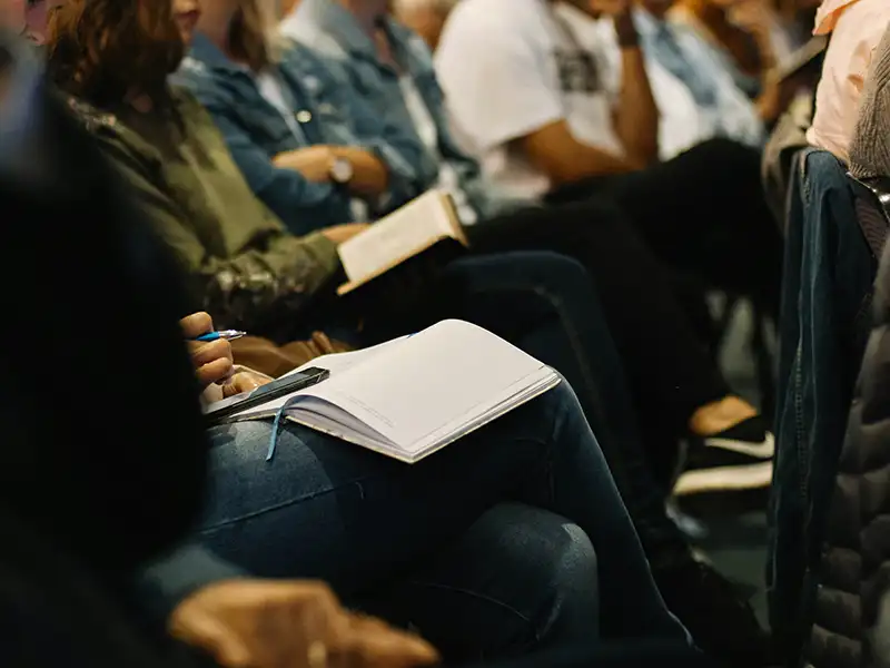 People listening to a community energy event